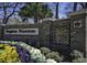 The Kingston Plantation entrance with a brick sign and beautifully landscaped flower beds at 9820 Queensway Blvd. # 706, Myrtle Beach, SC 29572