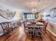 Inviting living room with wood floors, decorative chandelier, and ocean view at 9820 Queensway Blvd. # 706, Myrtle Beach, SC 29572