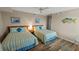 Comfortable bedroom with two twin beds, wood floor and coastal decor at 9994 Beach Club Dr. # 2408, Myrtle Beach, SC 29572