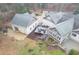 Aerial view of a house with a large backyard, patio, garage, and landscaping at 1 Sun Ct., Carolina Shores, NC 28467