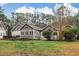 Image of backyard, highlighting the outdoor living space, lawn and landscaping at 1 Sun Ct., Carolina Shores, NC 28467
