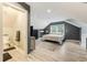 Bedroom with a connected ensuite bathroom, window and gray modern decor at 1 Sun Ct., Carolina Shores, NC 28467