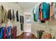 Walk-in closet featuring wood floor, white shelving and hanging storage at 1 Sun Ct., Carolina Shores, NC 28467