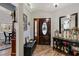 Inviting entryway with hardwood floors, decorative touches, and a stylish front door at 1 Sun Ct., Carolina Shores, NC 28467