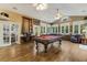 Spacious game room featuring a pool table, hardwood floors, recessed lighting, and windows for natural light at 1 Sun Ct., Carolina Shores, NC 28467