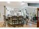 Open-concept kitchen with a large island, modern lighting, and a breakfast bar with wrought iron seating at 1 Sun Ct., Carolina Shores, NC 28467