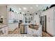 Well-appointed kitchen with stainless steel appliances, custom cabinetry, and lots of natural light at 1 Sun Ct., Carolina Shores, NC 28467