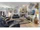 Cozy living room with a stone fireplace, comfortable seating, and a large decorative rug at 1 Sun Ct., Carolina Shores, NC 28467