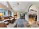 Spacious living room with vaulted ceiling, plush seating, hardwood floors, and an open layout at 1 Sun Ct., Carolina Shores, NC 28467