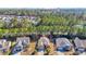 Stunning aerial view of the neighborhood with the home centered, surrounded by lush trees and manicured lawns at 110 Summerlight Dr., Murrells Inlet, SC 29576