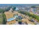 Aerial view of the neighborhood showing the community pool and surrounding homes nestled by a lake at 110 Summerlight Dr., Murrells Inlet, SC 29576