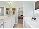 Clean bathroom with double sink vanity, tub, and access to the main bedroom at 110 Summerlight Dr., Murrells Inlet, SC 29576