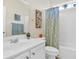 Clean bathroom with a white vanity, tub-shower, and decorative accents, offering a functional and tidy space at 110 Summerlight Dr., Murrells Inlet, SC 29576