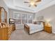 Spacious bedroom with neutral walls, multiple windows, and a ceiling fan at 110 Summerlight Dr., Murrells Inlet, SC 29576