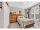 Comfortable bedroom with light carpet, ceiling fan, and natural light from a window at 110 Summerlight Dr., Murrells Inlet, SC 29576