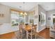 Bright dining room boasts natural light and a cozy atmosphere at 110 Summerlight Dr., Murrells Inlet, SC 29576