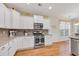Well-lit kitchen featuring white cabinets, stainless steel appliances, and granite countertops at 110 Summerlight Dr., Murrells Inlet, SC 29576