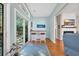 Bright room featuring a bar, wood floors, fireplace, and a large sliding door to the outside at 110 Summerlight Dr., Murrells Inlet, SC 29576