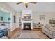 Bright living room with a fireplace and plush ottoman at 110 Summerlight Dr., Murrells Inlet, SC 29576