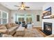 Cozy living room boasts a fireplace and access to the outdoor patio at 110 Summerlight Dr., Murrells Inlet, SC 29576