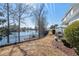 A spacious fenced-in backyard with a patio overlooking a serene lake at 118 Gully Branch Ln. # 3, Myrtle Beach, SC 29572