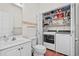A half bathroom complete with a washer and dryer hidden inside a closet at 118 Gully Branch Ln. # 3, Myrtle Beach, SC 29572