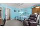 Spacious bedroom with carpet, ceiling fan, and a comfortable recliner chair at 118 Gully Branch Ln. # 3, Myrtle Beach, SC 29572
