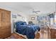 Bright bedroom with hardwood floors, ceiling fan, and ample natural light at 118 Gully Branch Ln. # 3, Myrtle Beach, SC 29572