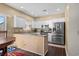Bright kitchen featuring granite countertops, white cabinetry, and stainless steel appliances at 118 Gully Branch Ln. # 3, Myrtle Beach, SC 29572