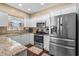 Well-equipped kitchen featuring stainless steel appliances, granite counters, and ample cabinet space at 118 Gully Branch Ln. # 3, Myrtle Beach, SC 29572