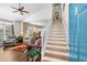 Open-concept living area with staircase, showcasing a bright and airy design with comfortable seating at 118 Gully Branch Ln. # 3, Myrtle Beach, SC 29572