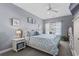 Serene bedroom with a ceiling fan and bright window views, offering a peaceful retreat at 118 Gully Branch Ln. # 3, Myrtle Beach, SC 29572