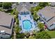 An aerial view of the community pool with deck chairs and lush greenery at 118 Gully Branch Ln. # 3, Myrtle Beach, SC 29572