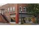 Exterior of a three story brick commercial building, with striped awnings, and a street view at 1434 Porchfield Dr., Conway, SC 29526