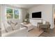 Cozy living room with a large window, comfortable seating, and stylish decor, perfect for relaxing and entertaining guests at 1434 Porchfield Dr., Conway, SC 29526