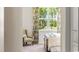 Bedroom with window, patterned chair and a view into the trees at 1442 Porchfield Dr., Conway, SC 29526