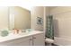 Clean bathroom with a white vanity, large mirror, and bathtub with a shower featuring a patterned curtain at 1446 Porchfield Dr., Conway, SC 29526