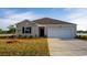 Charming single-story home with a well-manicured lawn and an attached two-car garage at 1446 Porchfield Dr., Conway, SC 29526