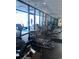 Well-equipped gym with various cardio machines and large windows at 1605 S Ocean Blvd. # 106, Myrtle Beach, SC 29577