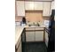 Bright kitchen featuring white cabinets and essential appliances for convenient meal preparation at 1605 S Ocean Blvd. # 106, Myrtle Beach, SC 29577