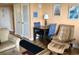 Comfortable living space with a cozy armchair, dining table, and pleasant decor at 1605 S Ocean Blvd. # 106, Myrtle Beach, SC 29577