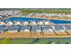 An aerial view of new homes overlooking a scenic pond with lush landscaping at 166 New Paradise Way, Myrtle Beach, SC 29588