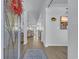 Bright foyer with wood flooring, an area rug, and a view into the dining and living areas at 166 New Paradise Way, Myrtle Beach, SC 29588