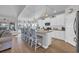 Bright and airy kitchen with a large island, bar stools, and modern appliances at 166 New Paradise Way, Myrtle Beach, SC 29588