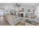 A bright open concept living room with a vaulted ceiling, a fireplace and nice furniture at 166 New Paradise Way, Myrtle Beach, SC 29588