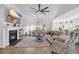 Inviting living room with a fireplace, ceiling fan, and comfortable seating at 166 New Paradise Way, Myrtle Beach, SC 29588