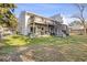 Spacious backyard with a deck, patio, and wooden stairs leading to the ground at 2005 Havens Dr., North Myrtle Beach, SC 29582