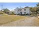 Two-story exterior elevation featuring classic architecture and an expansive lawn at 2005 Havens Dr., North Myrtle Beach, SC 29582