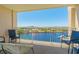 Balcony with comfortable seating and stunning waterfront views of a river and boats at 2151 Bridge View Ct. # 2-902, North Myrtle Beach, SC 29582