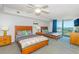 Bedroom featuring two beds, wooden dresser, TV, ceiling fan and view to the balcony at 2151 Bridge View Ct. # 2-902, North Myrtle Beach, SC 29582